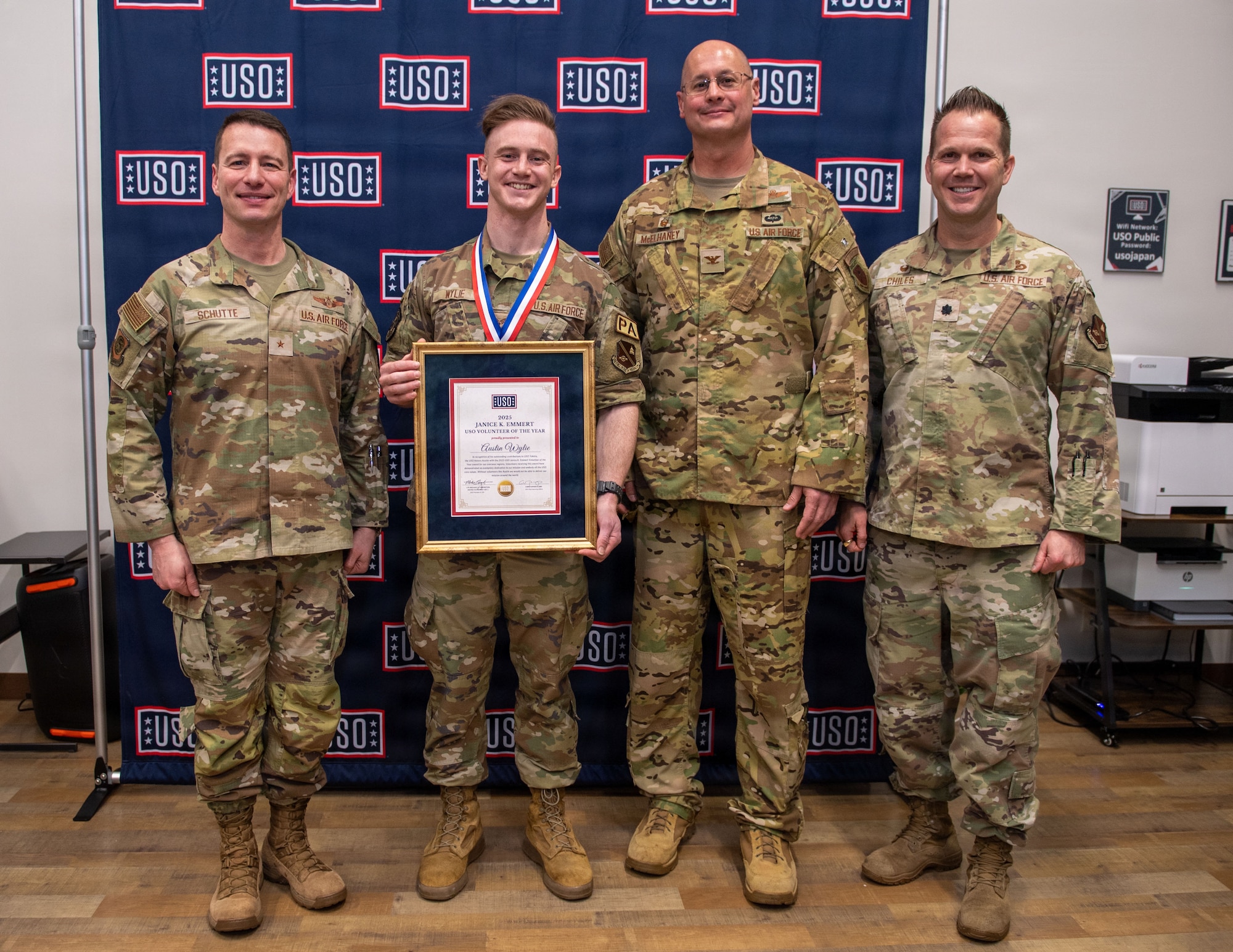 A group of men pose for a photo.