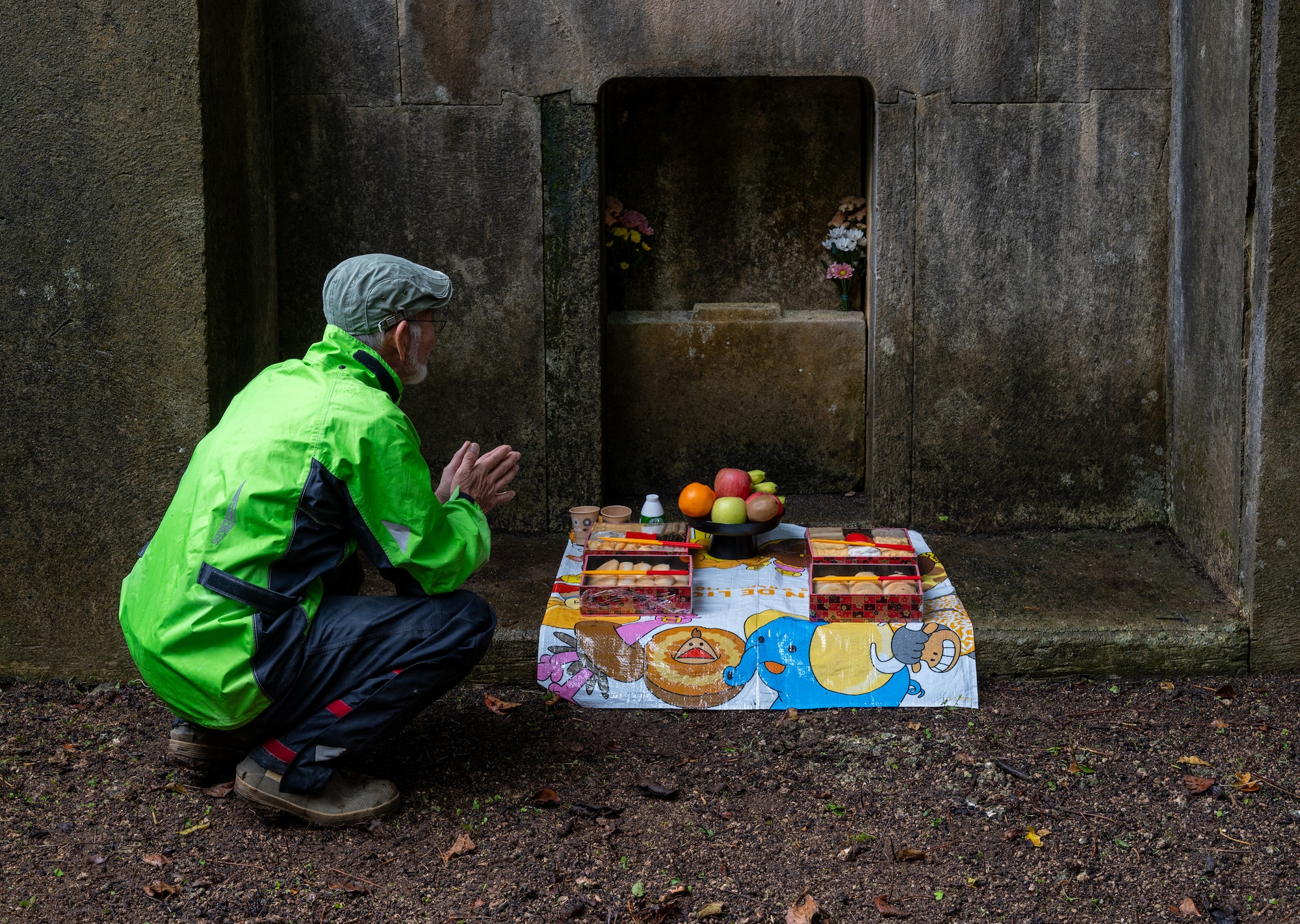 A local Okinawan prays to an ancestral tomb during Shimi at Kadena Air Base, Japan.