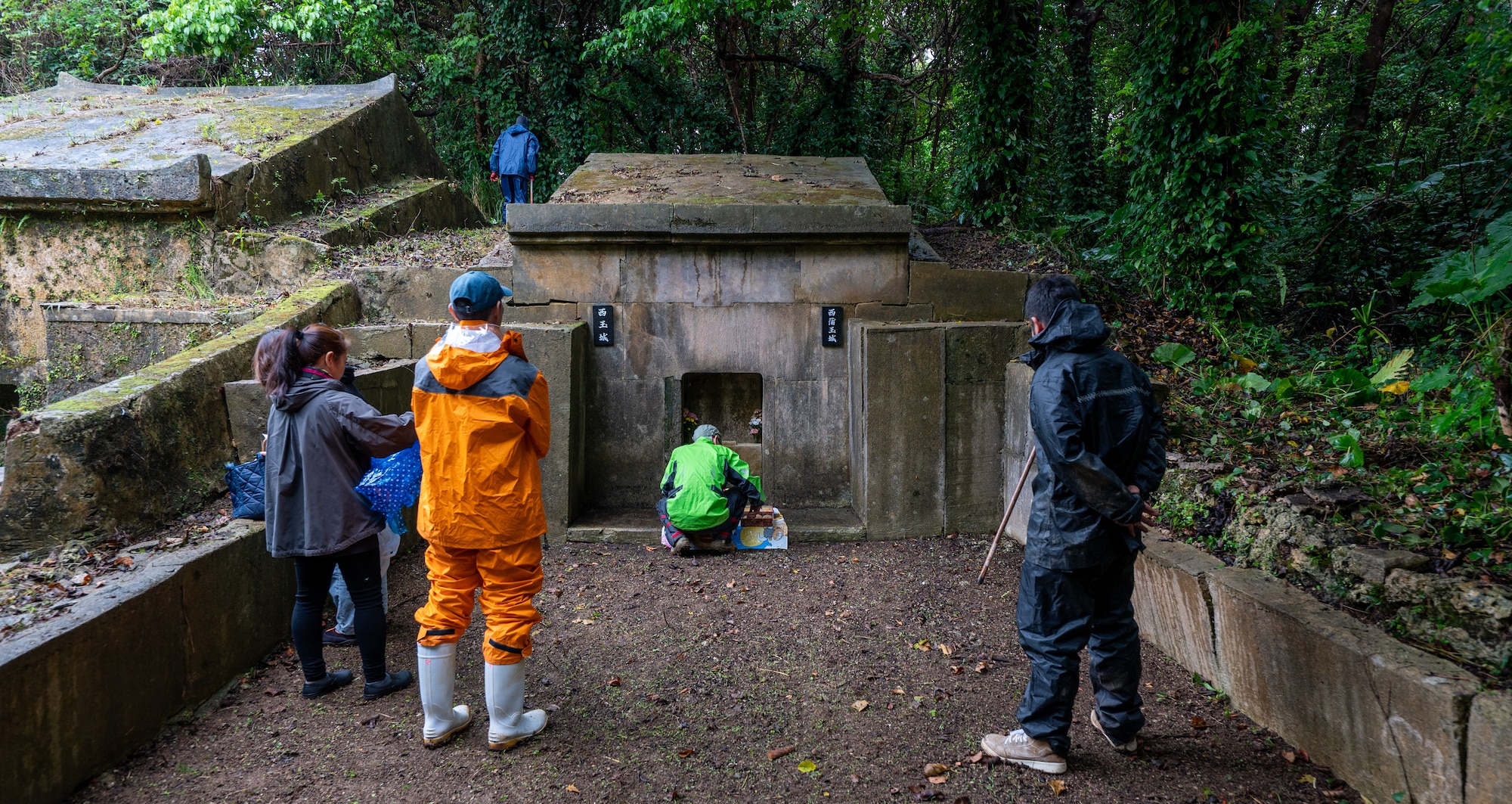 A local Okinawan family prays to an ancestral tomb during Shimi at Kadena Air Base, Japan.