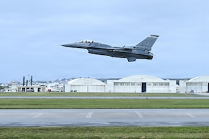 Aircraft taking off runway.