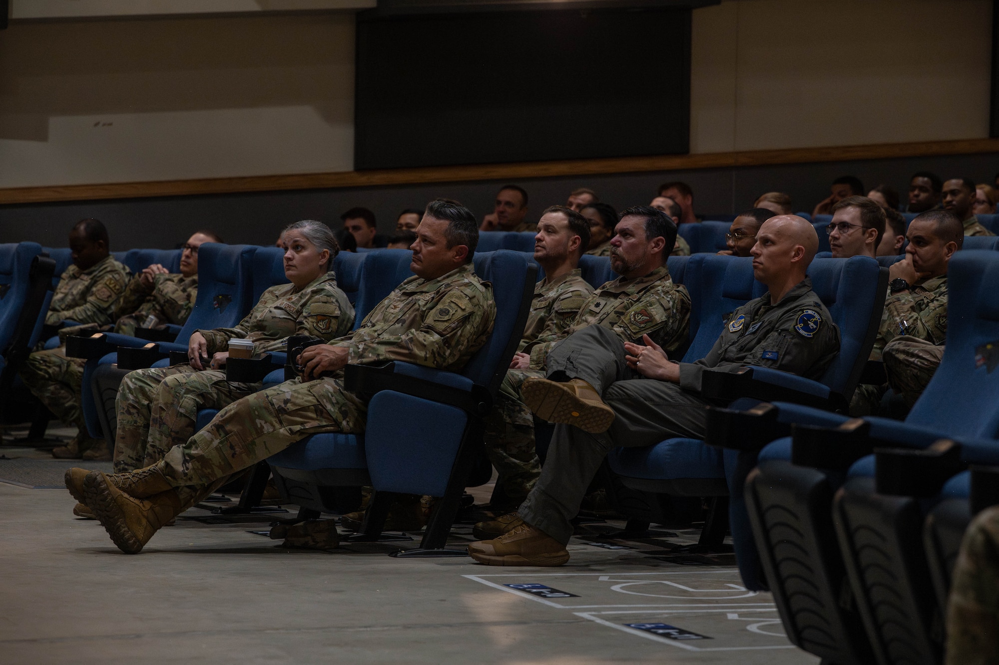 Wolf Pack leadership listen to guest speaker.