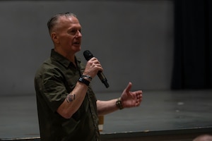 A guest speaker speaks to Wolf Pack.