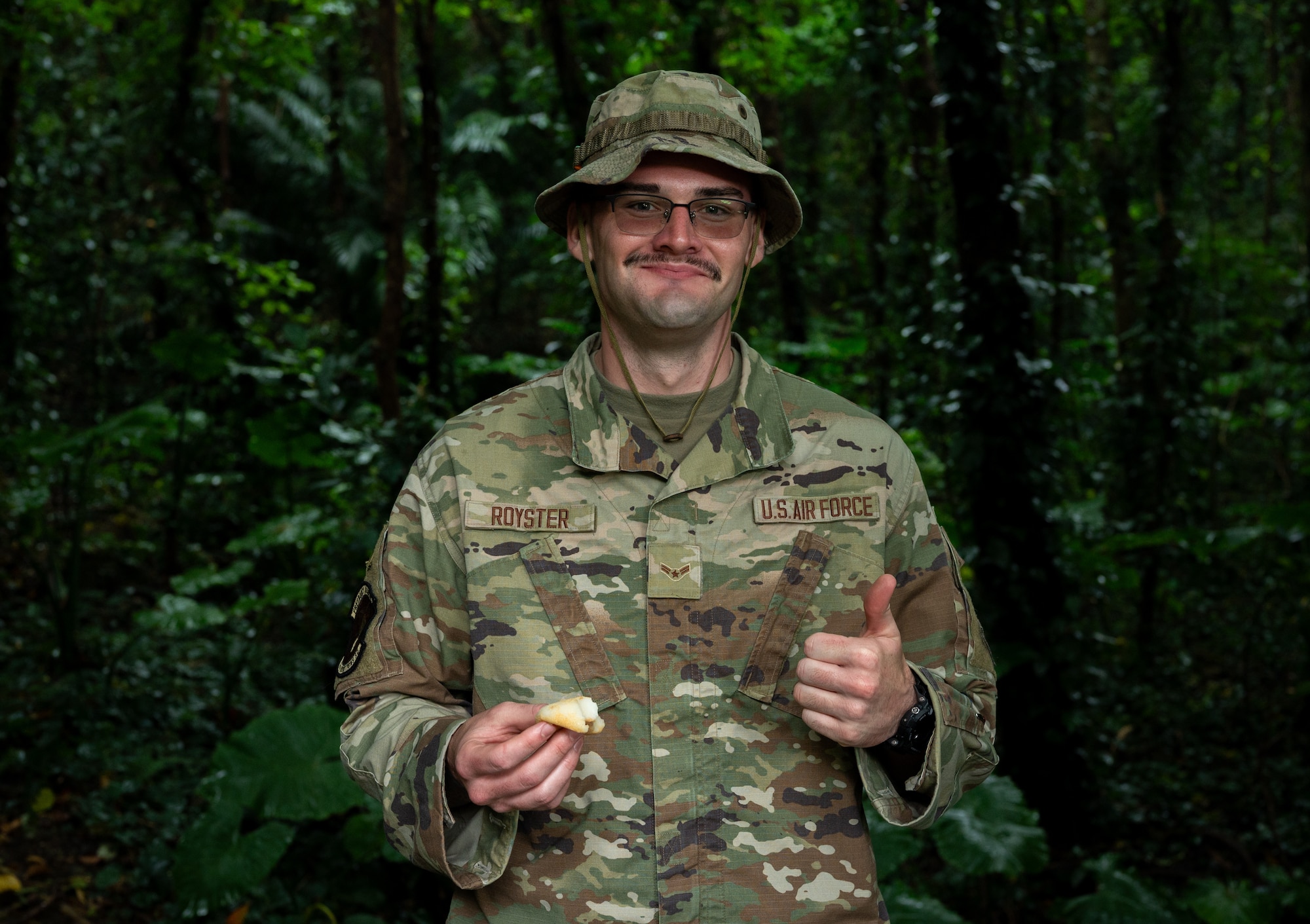 Airman 1st Class William Royster, 18th Munitions Squadron munitions support equipment maintenance crew chief, enjoys mochi during Shimi at Kadena Air Base, Japan.