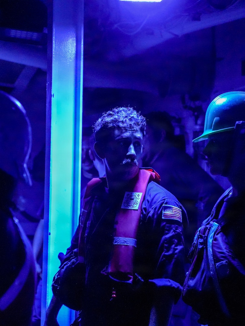 Petty Officer 2nd Class Peter Garcia, a boatswain’s mate assigned to Legend-class cutter USCGC Midgett (WMSL 757), prepares to board the 35-foot Long Range Interceptor-II cutter boat as a boat crew member, during the rescue of three members of a missing family from their 23-foot single-outboard skiff vessel in the waters of Chuuk State, Federated States of Micronesia during the early hours of April 6, 2026. The crew of Midgett rescued the family after the vessel went missing on March 30 in the waters of Chuuk State. U.S. Coast Guard missions in the Indo-Pacific focus on issues that directly support and advance our regional partners’ efforts to protect fish stocks and ensure the safety of life at sea, helping to ensure a secure and prosperous Indo-Pacific. (U.S. Coast Guard photo by Petty Officer 3rd Class Jennifer Nilson)
