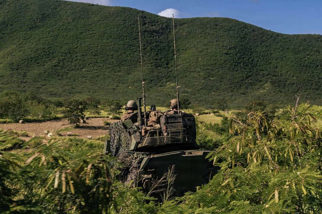 U.S. Marines with Light Armored Reconnaissance Company, Battalion Landing Team 3/6, 22nd Marine Expeditionary Unit (Special Operations Capable), observe terrain in a Light Armored Vehicle during maneuver and patrol training at Camp Santiago, Puerto Rico, March 18, 2026. U.S. military forces are deployed to the Caribbean in support of the U.S. Southern Command mission, Department of War-directed operations, and the president’s priorities to disrupt illicit drug trafficking and protect the homeland. (U.S. Marine Corps photo)