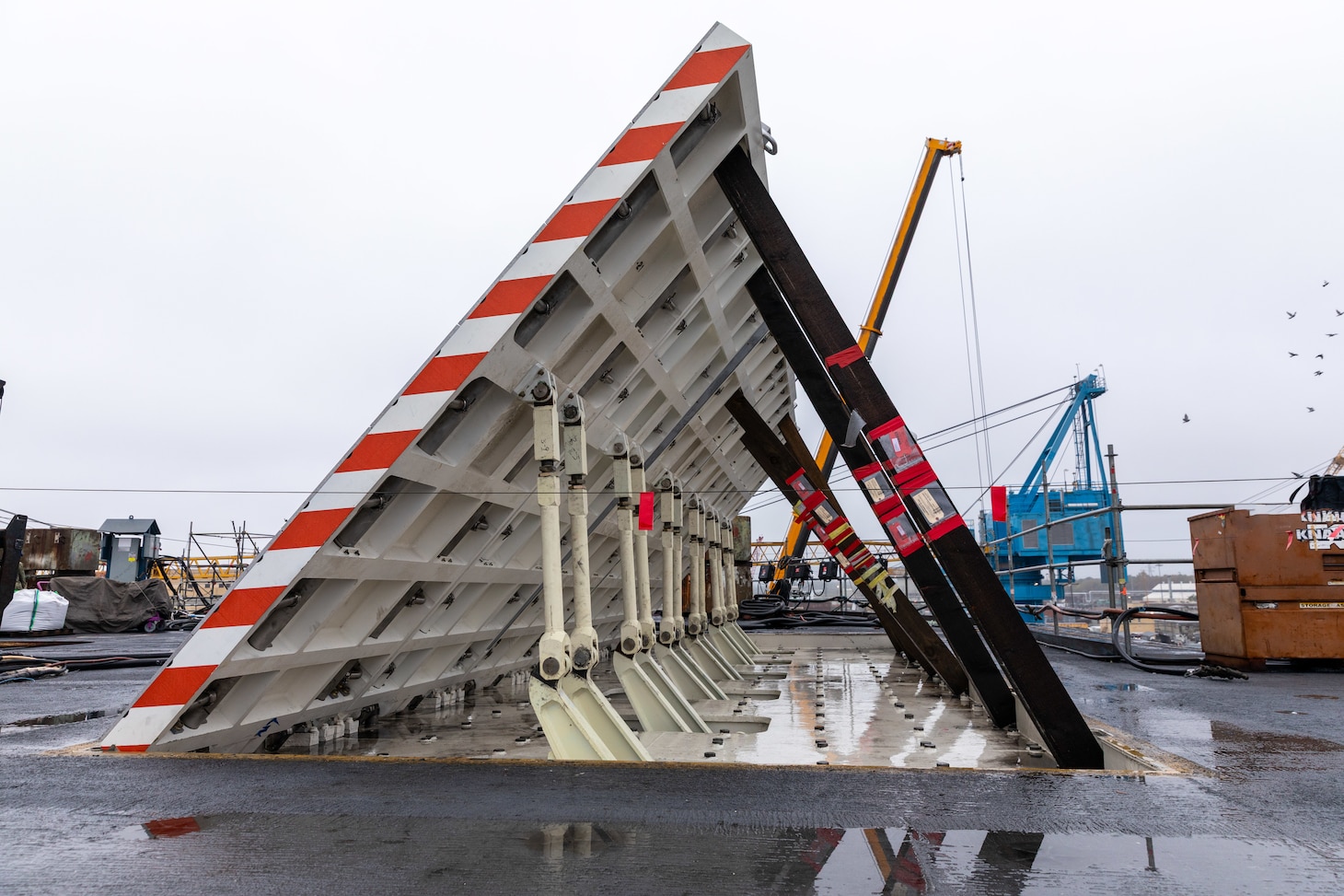 The Jet Blast Deflector Conveyor tool was developed by the Rapid Prototype Center in partnership with the toolmakers, Code 930, and Code 263 in order to lift and rotate the shafts in the jet blast deflector operating gear to eliminate the need for extensive rigging requirements as well as removing the need to cut access points to remove the fixture.