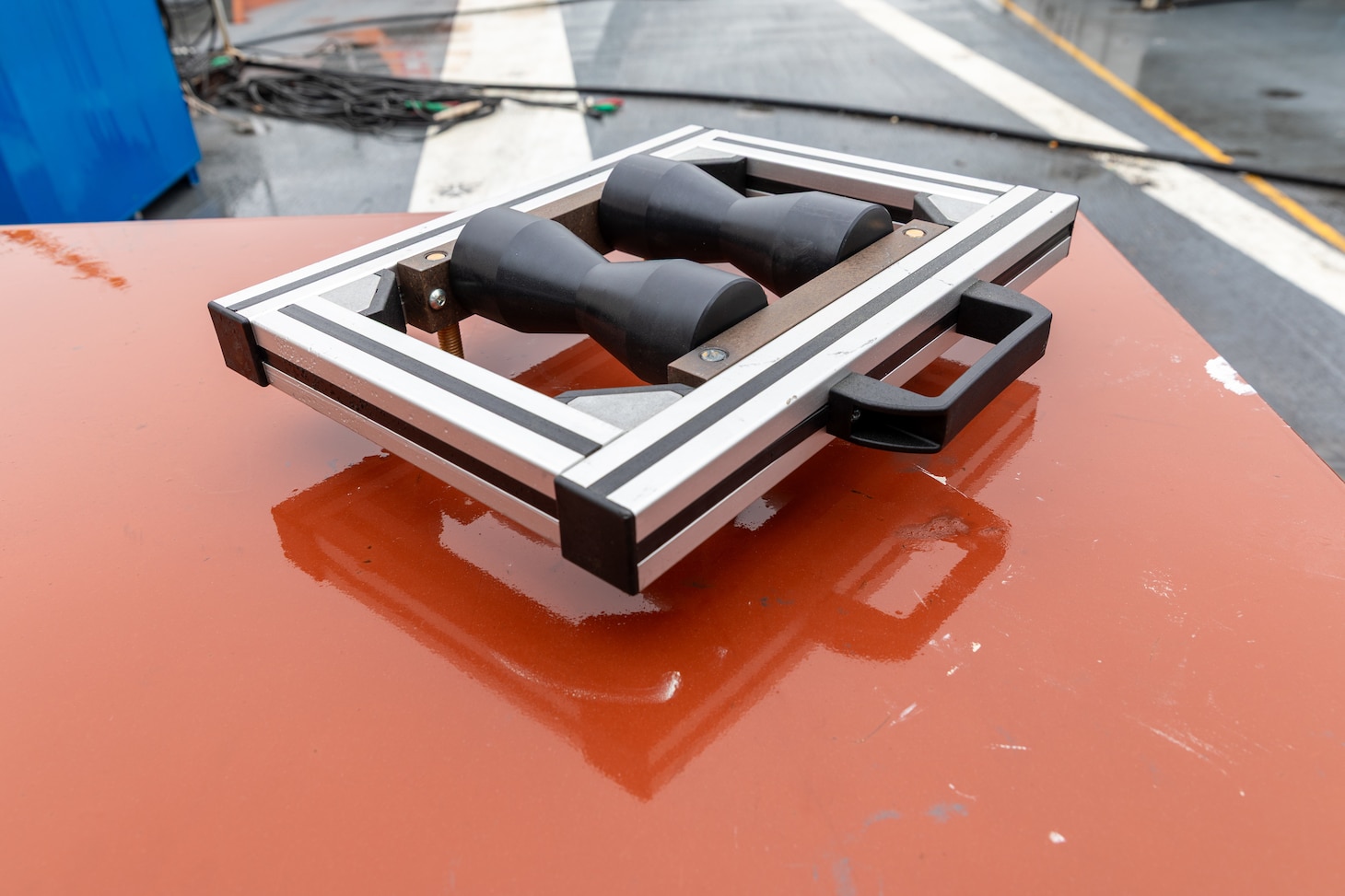 The Jet Blast Deflector Conveyor tool was developed by the Rapid Prototype Center in partnership with the toolmakers, Code 930, and Code 263 in order to lift and rotate the shafts in the jet blast deflector operating gear to eliminate the need for extensive rigging requirements as well as removing the need to cut access points to remove the fixture.