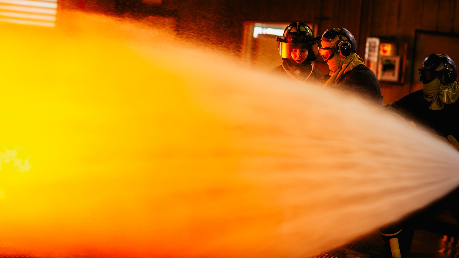 Sailors assigned to Nimitz-class aircraft carrier USS George Washington (CVN 73) combat a fire during an aircraft firefighting class at Surface Warfare School Command (SWSC) on Commander, Fleet Activities Yokosuka, March 14, 2025. SWSC familiarizes Sailors with basic chemistry and classification of fires, firefighting, protective equipment, and procedures for shipboard firefighting using simulated emergency firefighting conditions afloat and ashore.