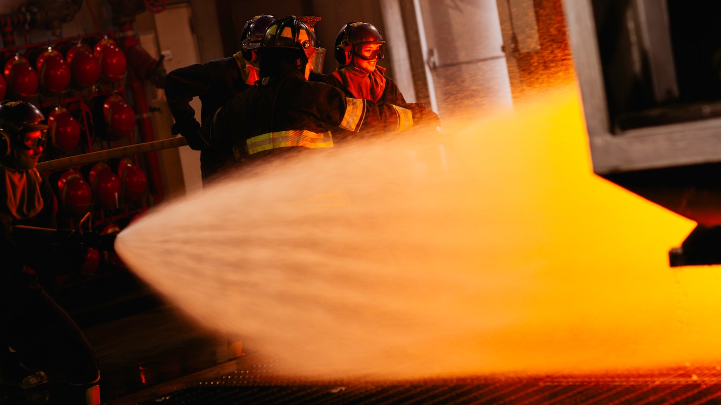 Sailors assigned to Nimitz-class aircraft carrier USS George Washington (CVN 73) combat a fire during an aircraft firefighting class at Surface Warfare School Command (SWSC) on Commander, Fleet Activities Yokosuka, March 14, 2025. SWSC familiarizes Sailors with basic chemistry and classification of fires, firefighting, protective equipment, and procedures for shipboard firefighting using simulated emergency firefighting conditions afloat and ashore.
