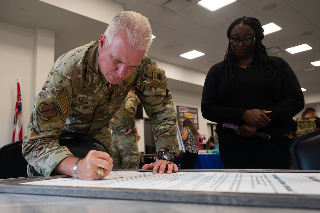 U.S. Air Force Col. Matthew Norton, 17th Training Wing commander, signs Proclamation 2026 during the Resiliency Expo