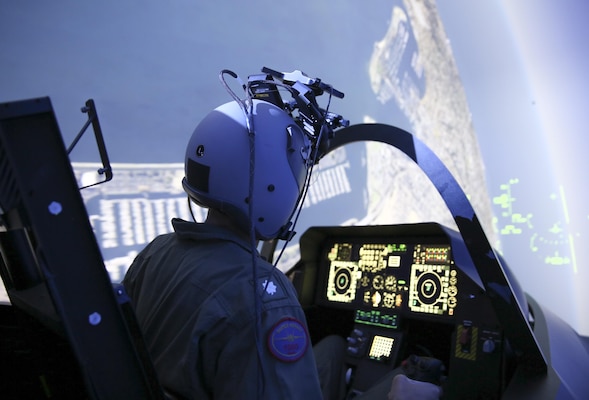 A pilot operates a simulator inside the Naval Air Warfare Center Aircraft Division’s Joint Simulation Environment at Naval Air Station Patuxent River, Md. The JSE enables pilots to train in highly realistic virtual combat scenarios, sharpening their skills and improving readiness.