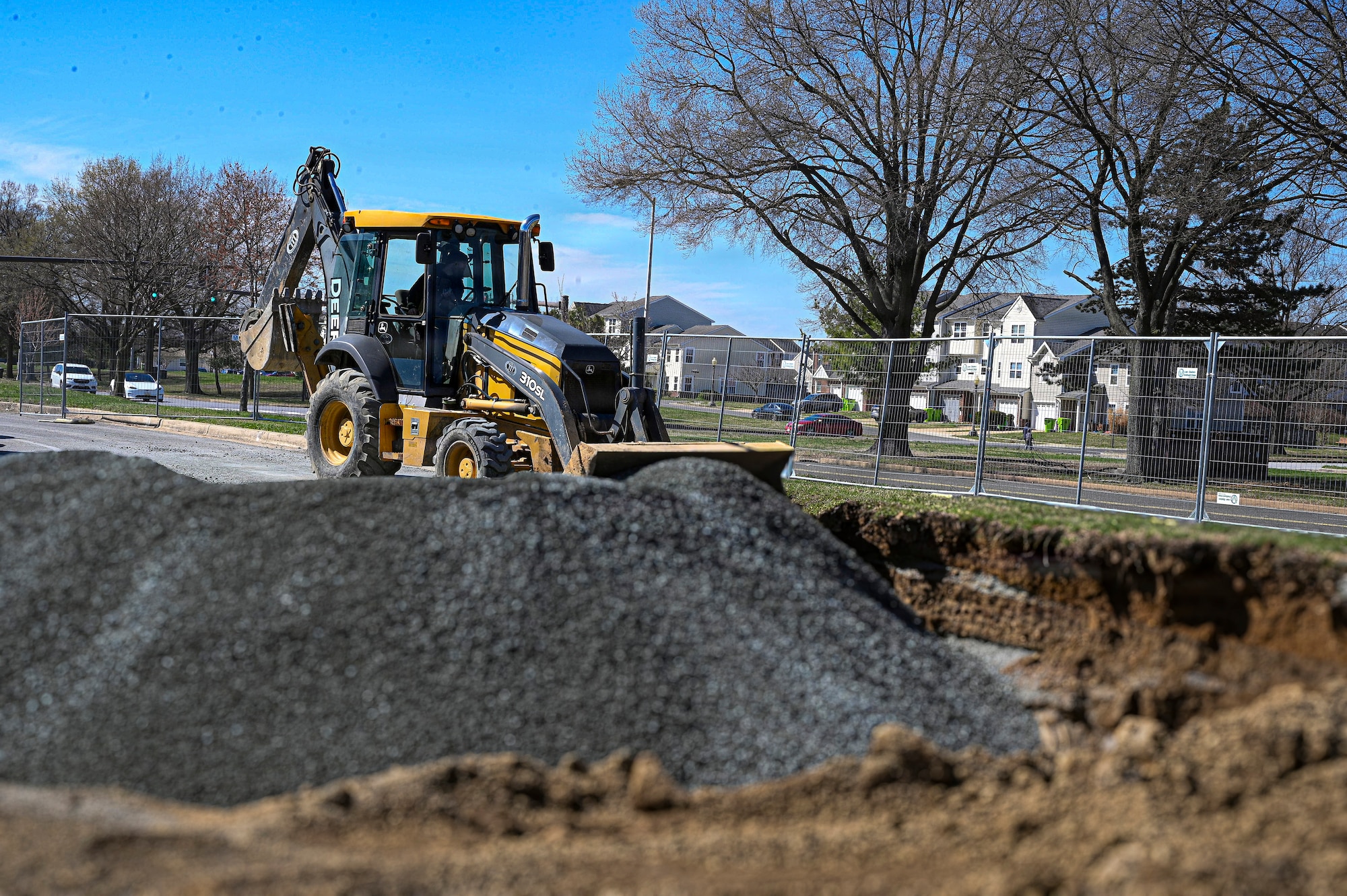 Josh Heflin, a field technician with TTI Environmental Inc., operates a backhoe during the base gas station construction project at Joint Base Anacostia-Bolling, Washington, D.C., March 26, 2026. The renovation replaced fuel lines and improved customer traffic flow during storage tank refueling, resulting in increased safety and improved quality of life on the base. (U.S. Air Force photo by Senior Airman Shanel Toussaint)