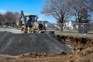 Josh Heflin, a field technician with TTI Environmental Inc., operates a backhoe during the base gas station construction project at Joint Base Anacostia-Bolling, Washington, D.C., March 26, 2026. The renovation replaced fuel lines and improved customer traffic flow during storage tank refueling, resulting in increased safety and improved quality of life on the base. (U.S. Air Force photo by Senior Airman Shanel Toussaint)