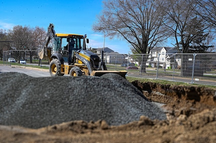 Josh Heflin, a field technician with TTI Environmental Inc., operates a backhoe during the base gas station construction project at Joint Base Anacostia-Bolling, Washington, D.C., March 26, 2026. The renovation replaced fuel lines and improved customer traffic flow during storage tank refueling, resulting in increased safety and improved quality of life on the base. (U.S. Air Force photo by Senior Airman Shanel Toussaint)