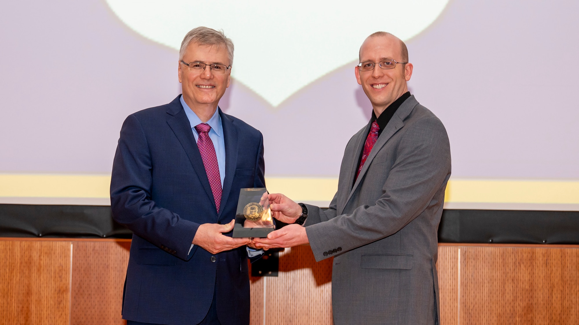 Richard Borth, right, receives the Harold Brown Award from Secretary of the Air Force Troy E. Meink.