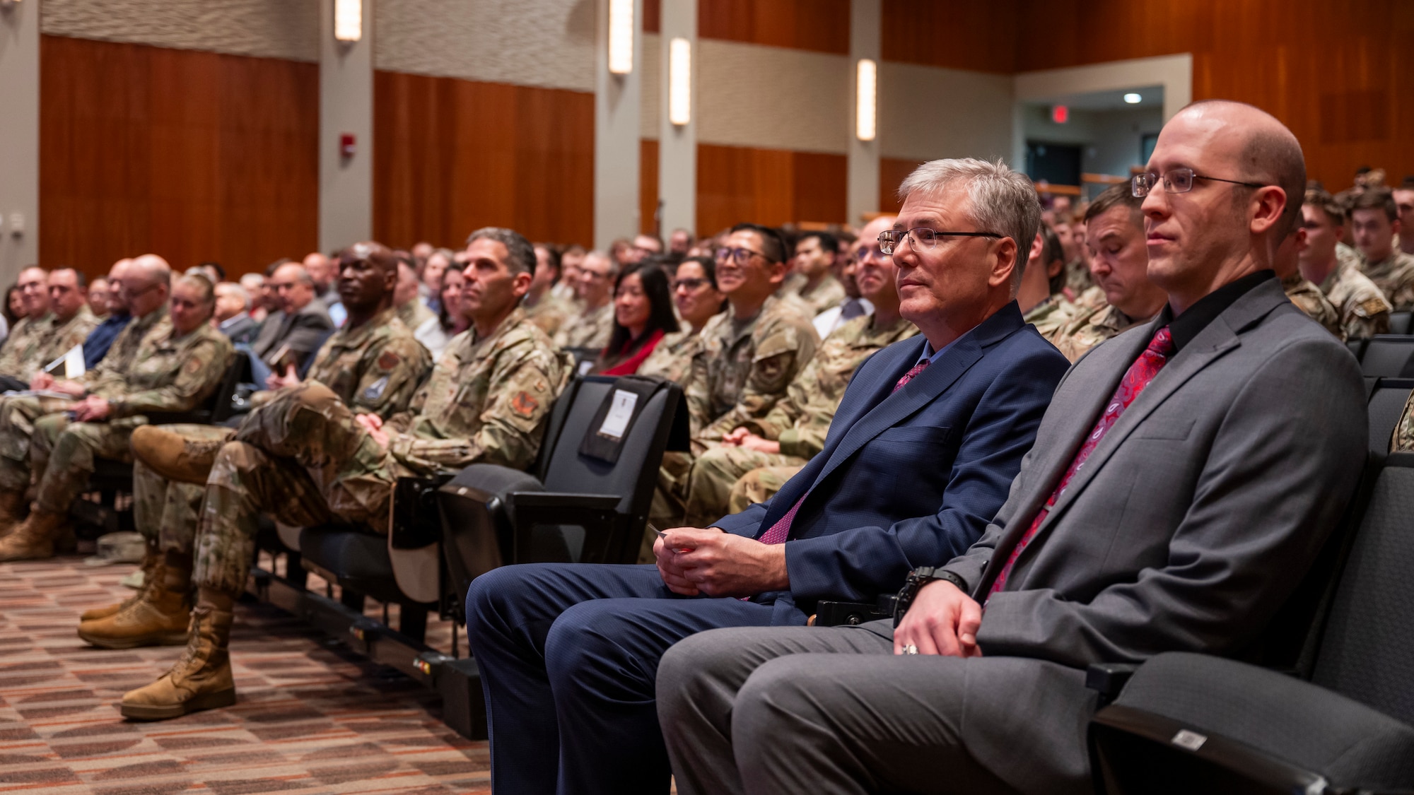 Richard Borth, right, and Secretary of the Air Force Troy E. Meink listens to the opening remarks during an all call.