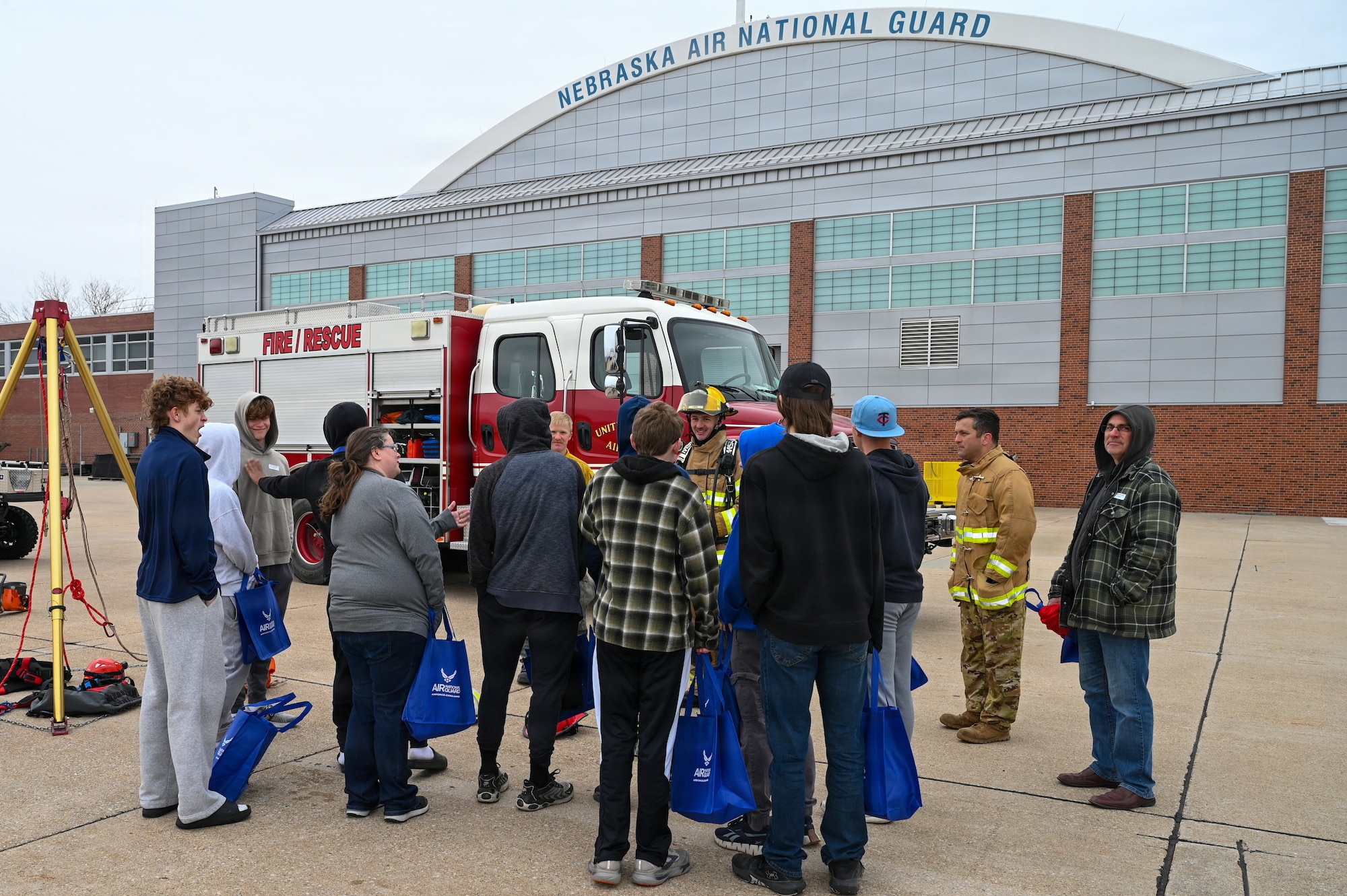 Airman Wyatt Svoboda, Airman First Class Jersten Zeleny, and Master Sergeant Michael Budke, 155th Civil Engineer Squadron firefighters, speak with students and families during the 155th Air Refueling Wing’s Open Hangar, April 1, 2026, at the Nebraska National Guard air base in Lincoln, Nebraska. The Open Hangar event gave students from around Nebraska the opportunity to meet Guardsmen from over 45 career fields and learn about the benefits to joining the Air National Guard. (U.S. Air National Guard photo by Tech. Sgt. Phil Cowen)