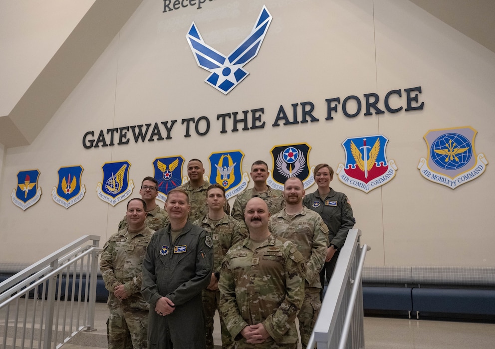 The Altus command team and senior enlisted leaders pose for a photo at the Pfingston Reception Center at Joint Base San Antonio-Lackland, Texas, April 1, 2026. The group attended the Airman’s Run, Coin and Retreat Ceremony, and the Basic Military Training graduation parade, strengthening ties between training and operational units. (U.S. Air Force photo by Airman 1st Class Emma Wright)