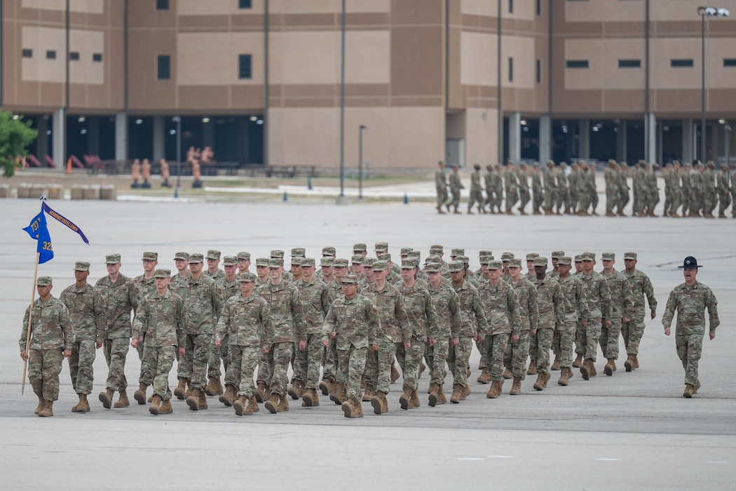 U.S. Air Force Basic Military Training trainees assigned to the 320th Training Squadron march in flight formation during the Coin and Retreat Ceremony at Joint Base San Antonio-Lackland, Texas, April 1, 2026. The Coin and Retreat Ceremony showcases trainees’ newly developed skills in conformity, discipline and drill excellence. (U.S. Air Force photo by Airman 1st Class Emma Wright)
