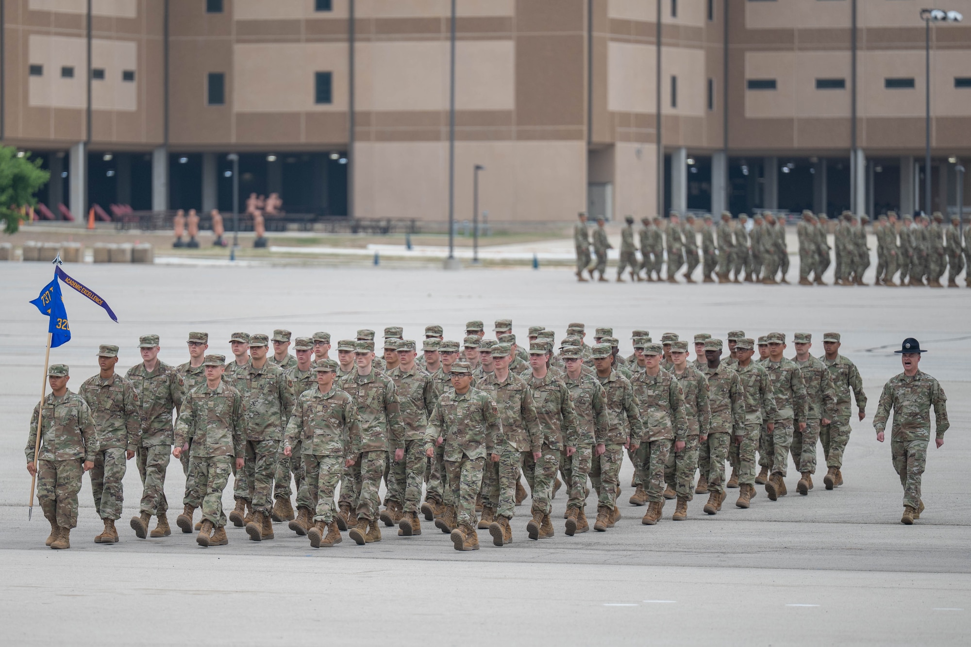 U.S. Air Force Basic Military Training trainees assigned to the 320th Training Squadron march in flight formation during the Coin and Retreat Ceremony at Joint Base San Antonio-Lackland, Texas, April 1, 2026. The Coin and Retreat Ceremony showcases trainees’ newly developed skills in conformity, discipline and drill excellence. (U.S. Air Force photo by Airman 1st Class Emma Wright)
