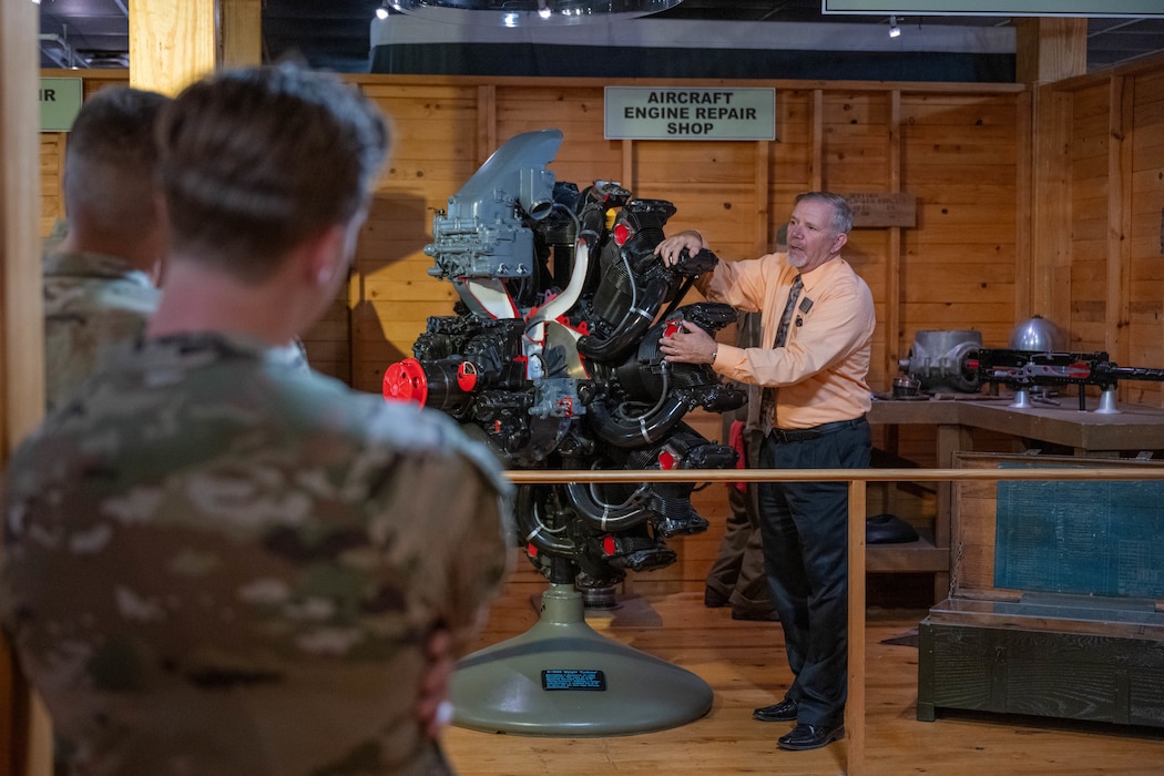William A. (Bill) Manchester, American Heritage Training Complex director, displays a R-1820 Wright ‘Cyclone’ at the American Heritage Museum at Joint Base San Antonio-Lackland, Texas, April 1, 2026. The 97th Air Mobility Wing command team and senior enlisted leaders were led on a guided tour of the museum that provided insight into the history and legacy that continue to shape today’s force. (U.S. Air Force photo by Airman 1st Class Emma Wright)