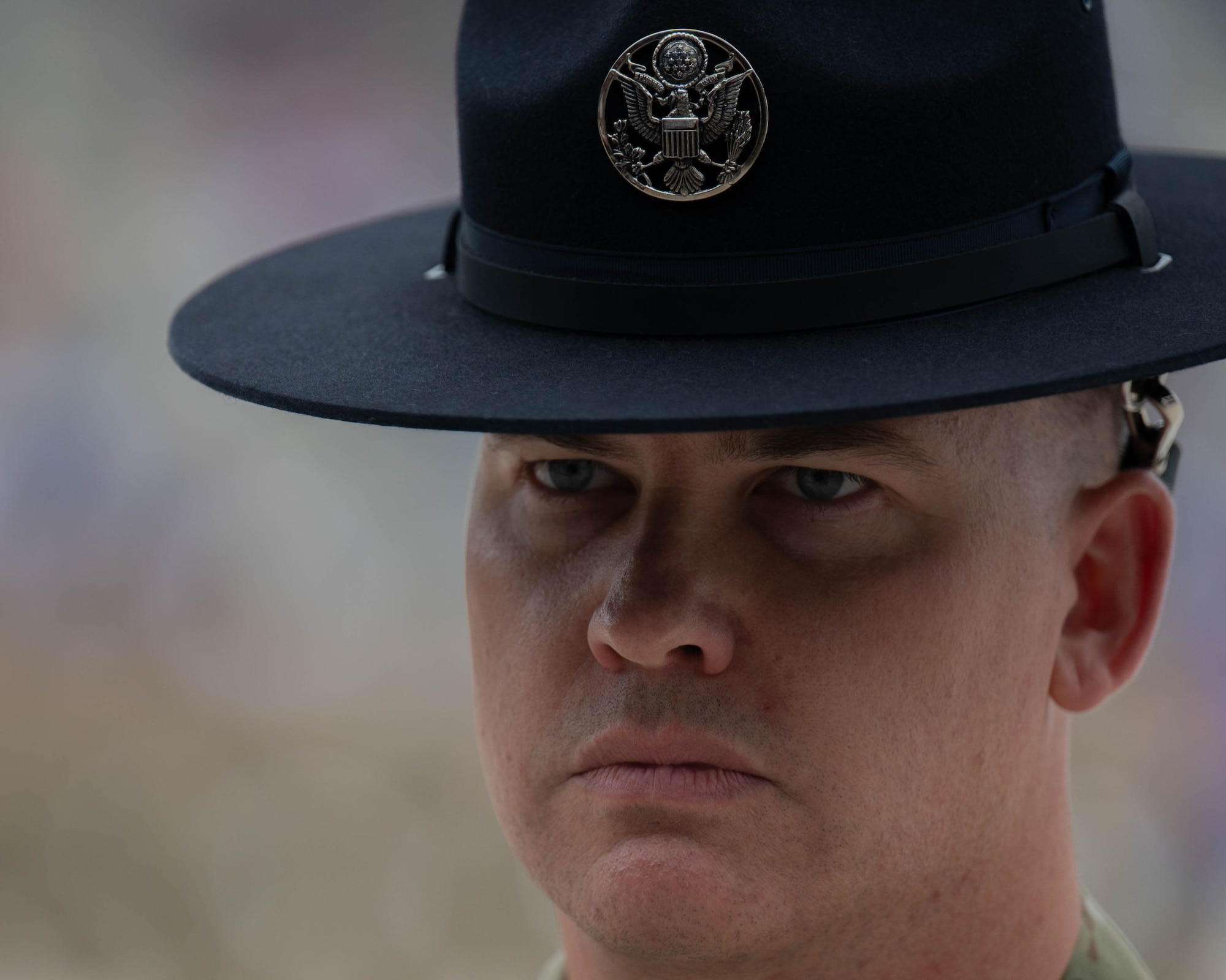 A U.S. Air Force military training instructor (MTI) looks forward during the Coin and Retreat Ceremony at Joint Base San Antonio-Lackland, Texas, April 1, 2026. MTI’s take part in the Coin and Retreat Ceremony, presenting trainees in their respective flights with their Airman’s Coin. (U.S. Air Force photo by Airman 1st Class Emma Wright)