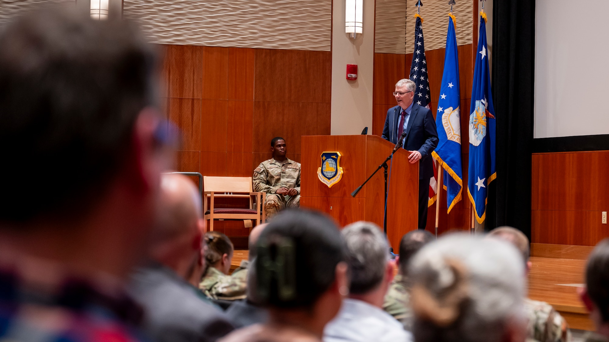 Secretary of the Air Force Troy E. Meink speaks to personnel during an all call.
