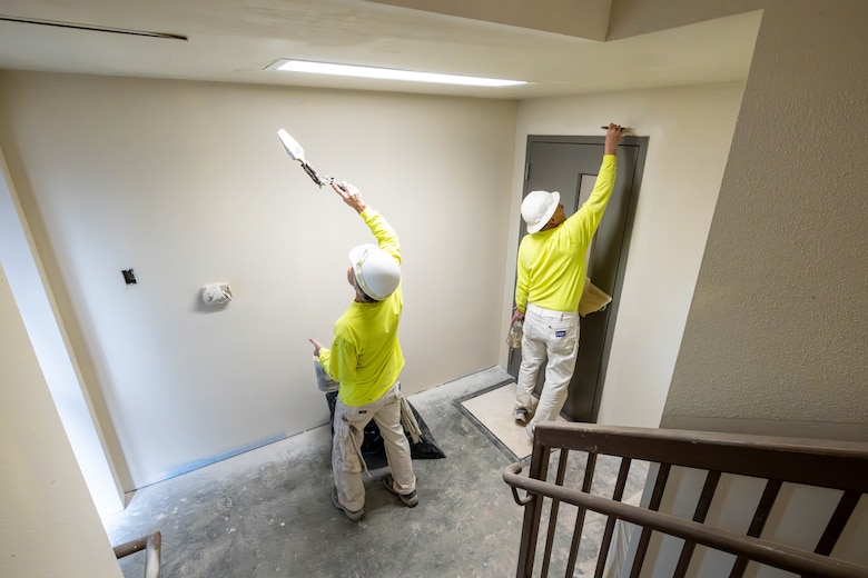Contractor's painting a hallway.