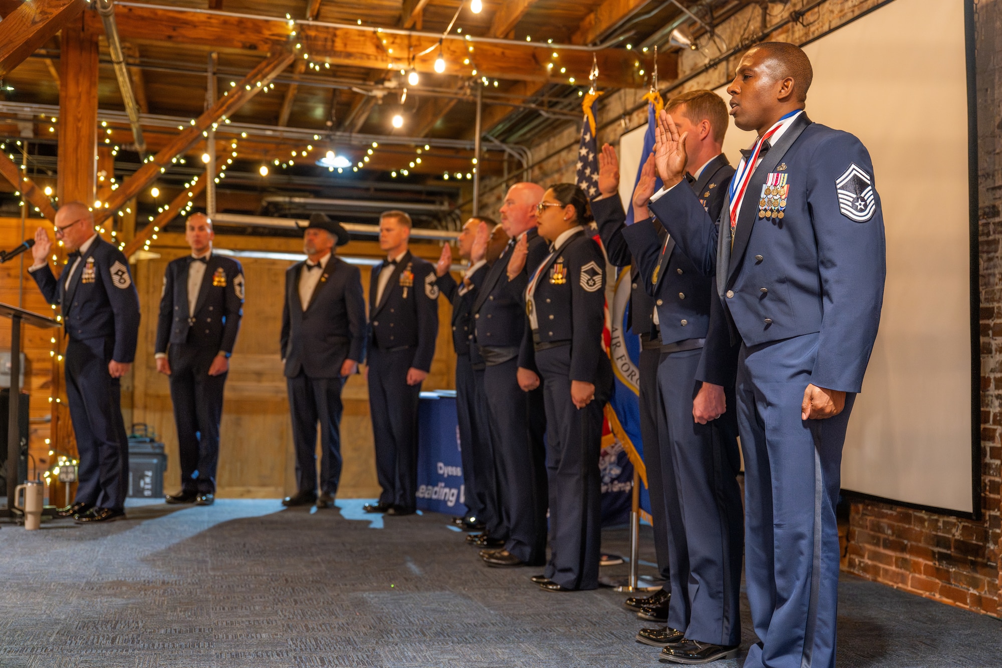 U.S. Air Force chief master sergeant selectees recite the Chief’s Charge during a Chief Master Sergeant Induction Ceremony in Abilene, Texas, March 28, 2026. Seven Airmen were formally inducted, marking their transition into the highest enlisted tier and their expanded responsibilities as senior enlisted leaders. (U.S. Air Force photo by Airman 1st Class Caleb Schellenberg)