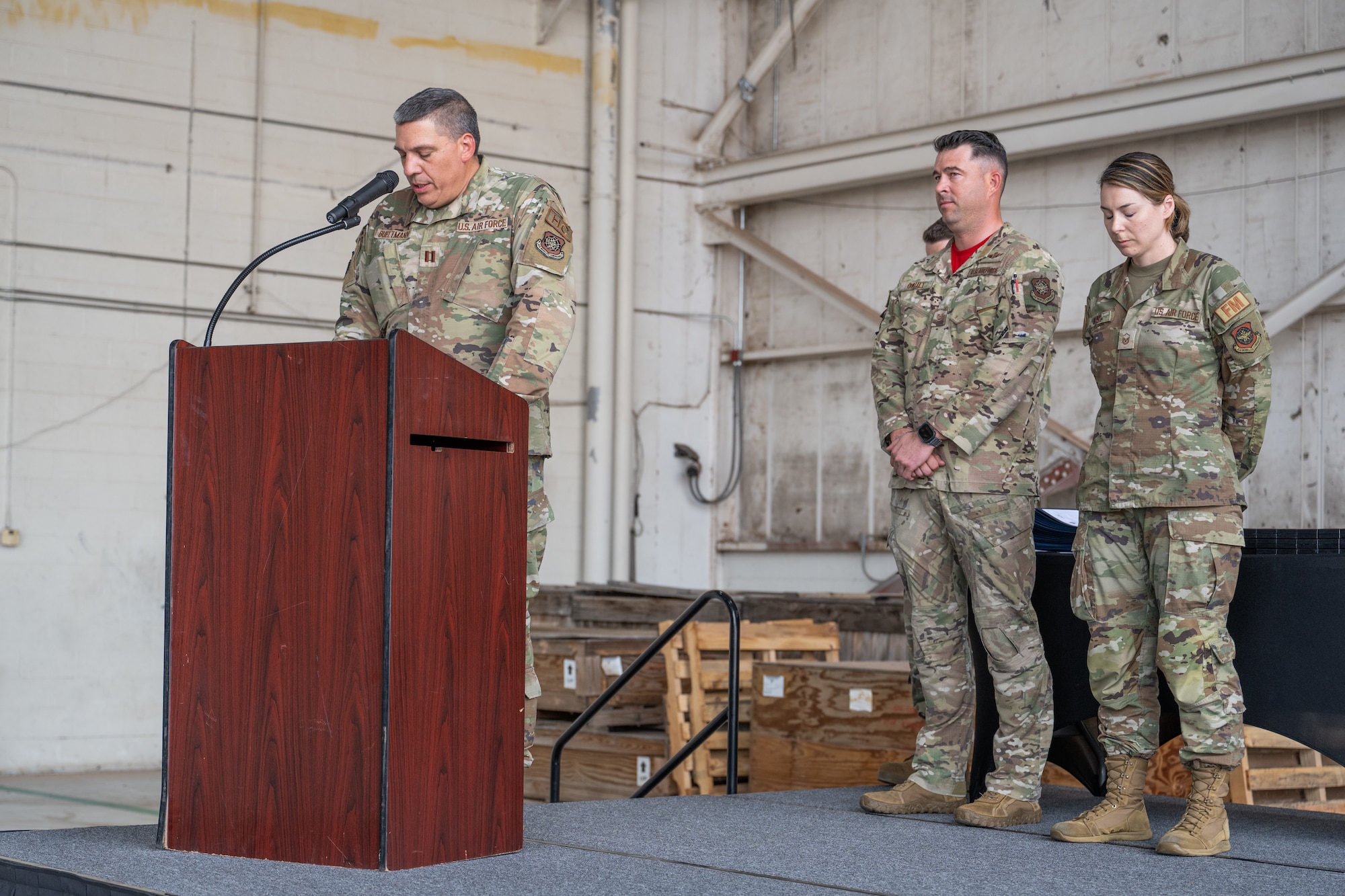 U.S. Air Force Capt. Kurtis Bueltmann, 317th Airlift Wing chaplain, leads a prayer during a Noncommissioned Officer Induction Ceremony at Dyess Air Force Base, Texas, April 3, 2026. The ceremony emphasized servant leadership, where mission accomplishment and the welfare of Airmen remain paramount. (U.S. Air Force photo by Airman 1st Class Caleb Schellenberg)