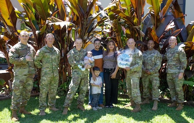 Isabella Serrano and U.S. Army Staff Sgt. Arthur A. Garcia, a cannon crew member from the 25th Infantry Division, were celebrated as the parents of the 25th baby born to the division in 2026. The recognition took place at Desmond T. Doss Health Clinic, Schofield Barracks, on April 1, 2026, with leadership from Tripler Army Medical Center and the 25th Infantry Division in attendance. Serrano expressed her appreciation for the TAMC Centering Pregnancy Program, describing it as the best experience she had during her pregnancy. (Defense Health Agency photo by Khinna Kaminske)
