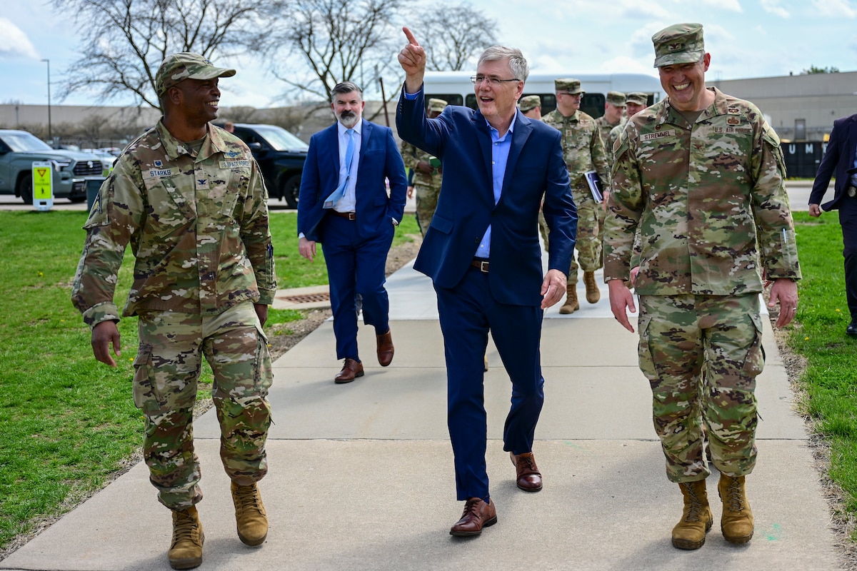From left, U.S. Space Force Col. Marcus Starks walks with Secretary of the Air Force Troy E. Meink and U.S. Air Force Col. Kenneth Stremmel.