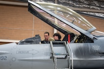 Airman shows foster teen an F-16 Fighting Falcon Cockpit