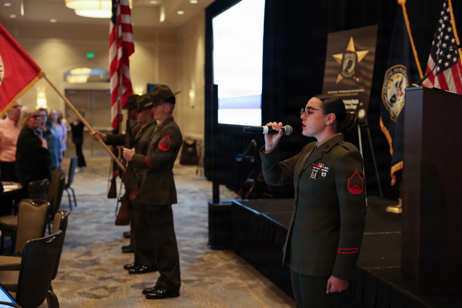 A U.S. Marine sings the national anthem during the Defense POW/MIA Accounting Agency Family Member Update in San Diego, Ca., March 28, 2026.