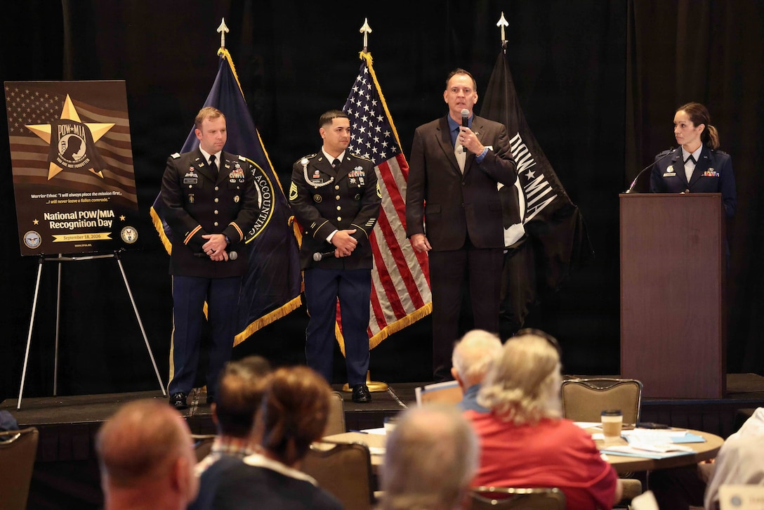 Personnel from the Defense POW/MIA Accounting Agency speak to the audience about life on recovery missions during the agency's Family Member Update in San Diego, Ca., March 28, 2026.