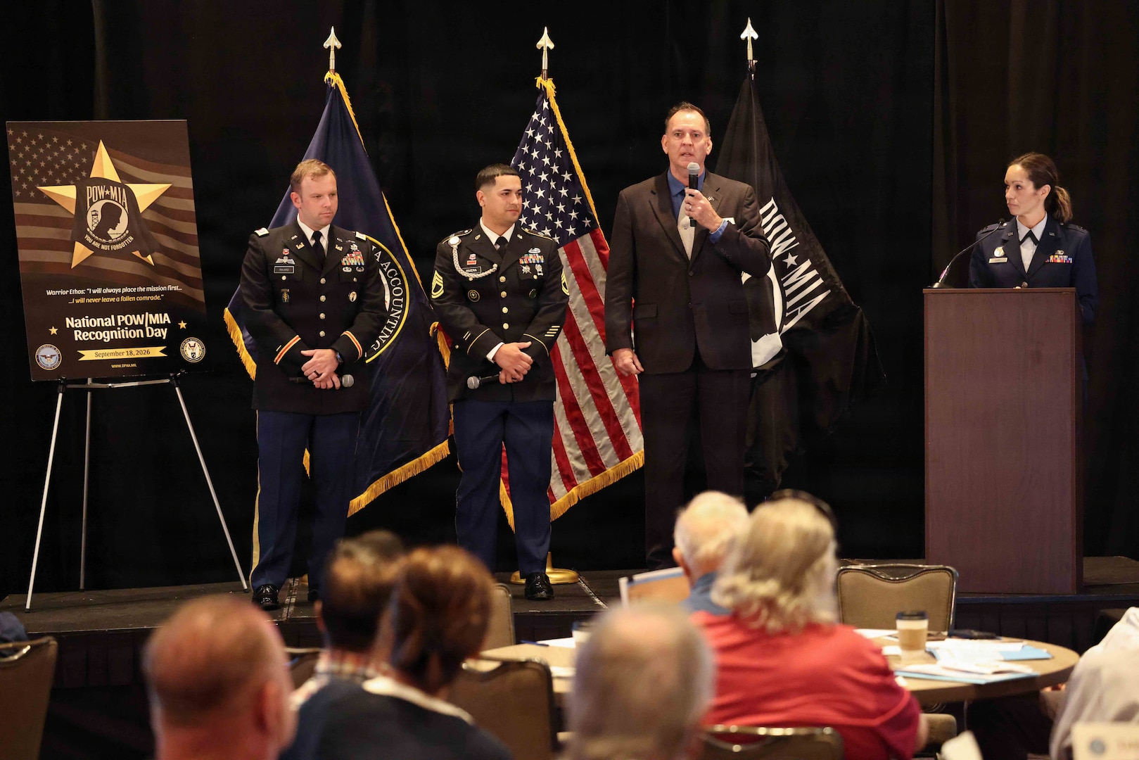 Personnel from the Defense POW/MIA Accounting Agency speak to the audience about life on recovery missions during the agency's Family Member Update in San Diego, Ca., March 28, 2026.