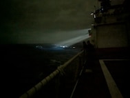 Bridge watchstanders aboard the Legend-class cutter USCGC Midgett (WMSL 757) locate a 23-foot single-outboard skiff vessel carrying three members of a missing family in the waters of Chuuk State, Federated States of Micronesia, during the early hours of April 6, 2026. The crew of Midgett rescued the family after the vessel went missing on March 30 in the waters of Chuuk State. (U.S. Coast Guard photo by Seaman Lauren Taber)