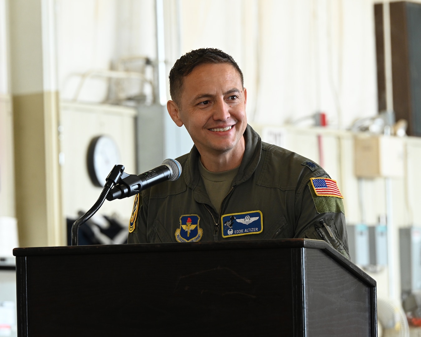 Lt. Col. Eddie Altizer, 48th Flying Training Squadron commander, gives final remarks during the T-1A Jayhawk retirement ceremony in the T-1 maintenance hangar at Columbus Air Force Base, Miss., March 25, 2026.