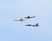 From top, a T-6 Texan II, T-1A Jayhawk, and T-38 Talon fly in formation over Columbus Air Force Base, Miss., March 24, 2026. The heritage formation was flown to honor the legacy of the T-1A Jayhawk as the airframe prepares for retirement after 30 years of service.