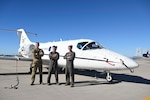 From left, Lt. Col. Richard Madden, 48th Flying Training Squadron deputy commander, Col. James J. Blech, 14th Flying Training Wing commander, Lt. Col Eddie Altizer, 48th Flying Training Squadron commander, standing in front of a T-1A Jayhawk at the 309th Aerospace Maintenance and Regeneration Group, commonly known as the 