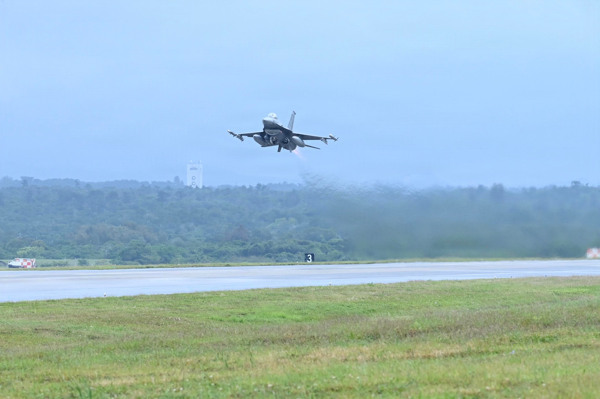 Aircraft takes off runway.