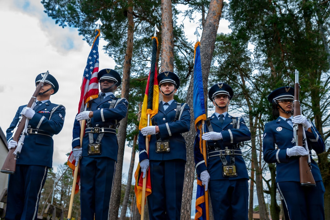 Ramstein Air Base honor guardsmen stand at port arms after a memorial service on Ramstein Air Base, Germany, March 12, 2026.