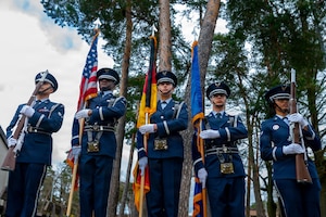 Ramstein Air Base honor guardsmen stand at port arms after a memorial service on Ramstein Air Base, Germany, March 12, 2026.