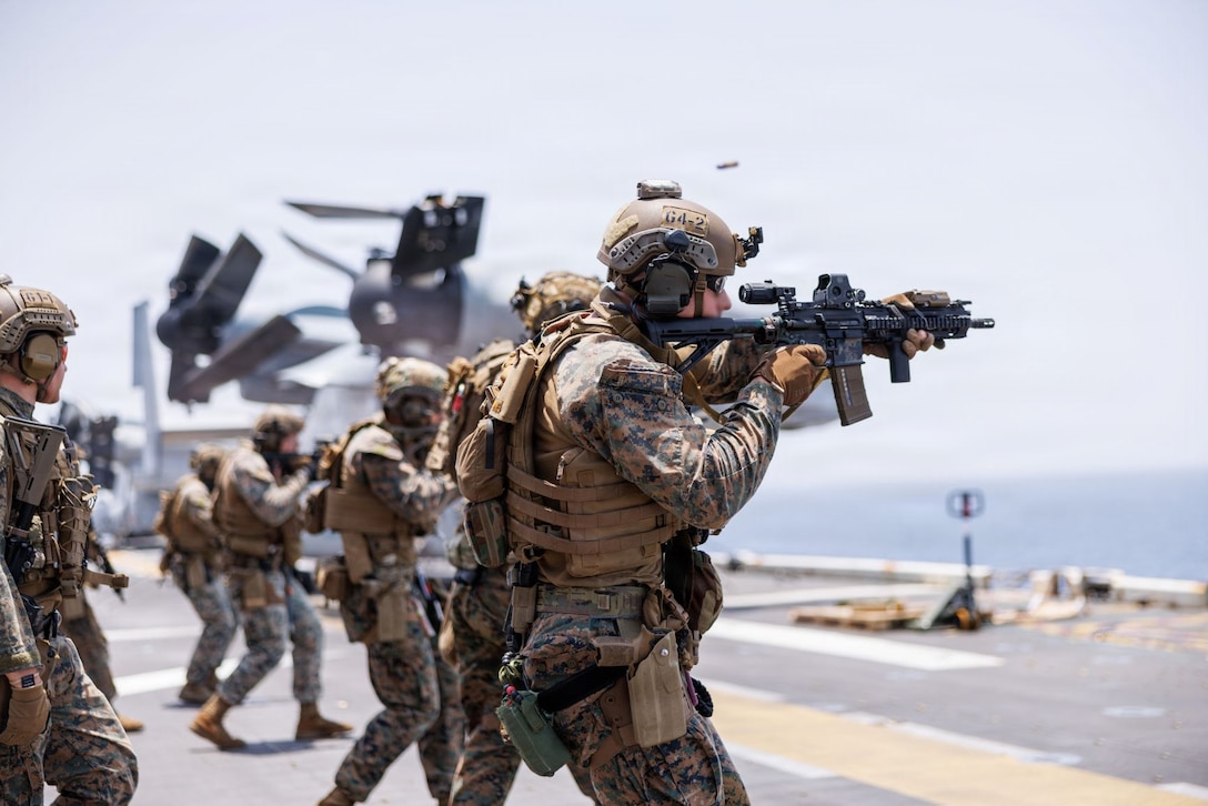 U.S. Marines fire rifles during a deck shoot aboard the forward-deployed amphibious assault ship USS Tripoli (LHA 7), in the U.S. Central Command area of responsibility during Operation Epic Fury, April 2, 2026. (U.S. Marine Corps photo)