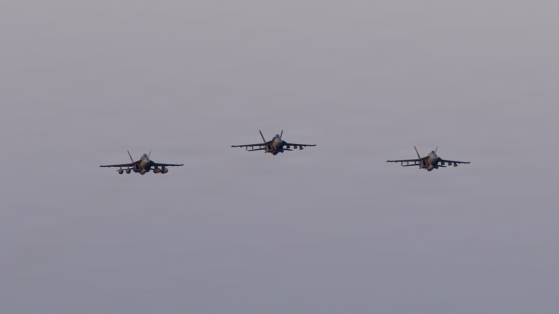 Three F/A-18E Super Hornets, attached to Strike Fighter Squadron (VFA) 14, fly over Nimitz-class aircraft carrier USS Abraham Lincoln (CVN 72) during Operation Epic Fury, April 2, 2026. (U.S. Navy photo)