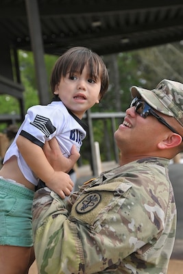 Soldier holding his son.