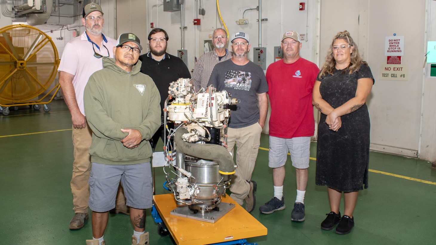 A cross-disciplinary team at Fleet Readiness Center East (FRCE) worked to successfully reestablish capability for the C-2A Greyhound auxiliary power unit when evolving fleet needs resulted in service life extension for the aircraft, which supports the U.S. Navy’s carrier onboard delivery mission. The team included, from left, Justin Rimmer, Engine Driven Compressor and Gas Turbine Compressor Shop supervisor; Edwin Agnes; Erik Dumas, senior engineer with the Naval Air Systems Command Gas Turbine Compressor/Pneumatics Fleet Support Team at FRCE; Anthony Jones; Grady Mayo; aircraft examiner Lawrence Murphy; and production controller Katia Councilman.
