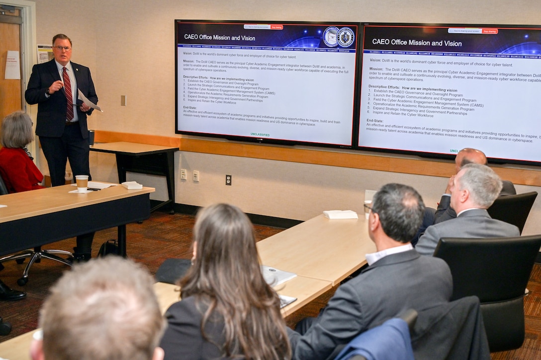 Scott Nelson, acting principal director for the Cyber Academic Engagement Office, discusses the CAEO mission and vision to civilian and government academic experts from multiple National Centers of Academic Excellence in Cybersecurity-designated universities, colleges and community colleges and government cyber academia program leads, Jan. 30, at the Pentagon. The forum gave academic experts, and program leaders the opportunity to come together and learn about each of the programs. The purpose behind the forum is to be the primer for further collaboration of new ideas and strategies.