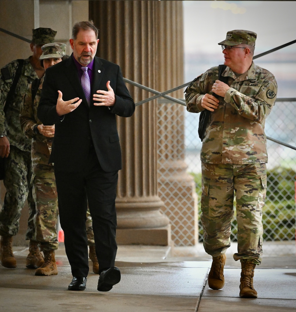 DLA Disposition Services Director Mike Cannon (SES), talks with Defense Logistics Agency Director Army Lt. Gen. Mark Simerly during his visit to the Hart-Dole-Inouye Federal Center on April 2.