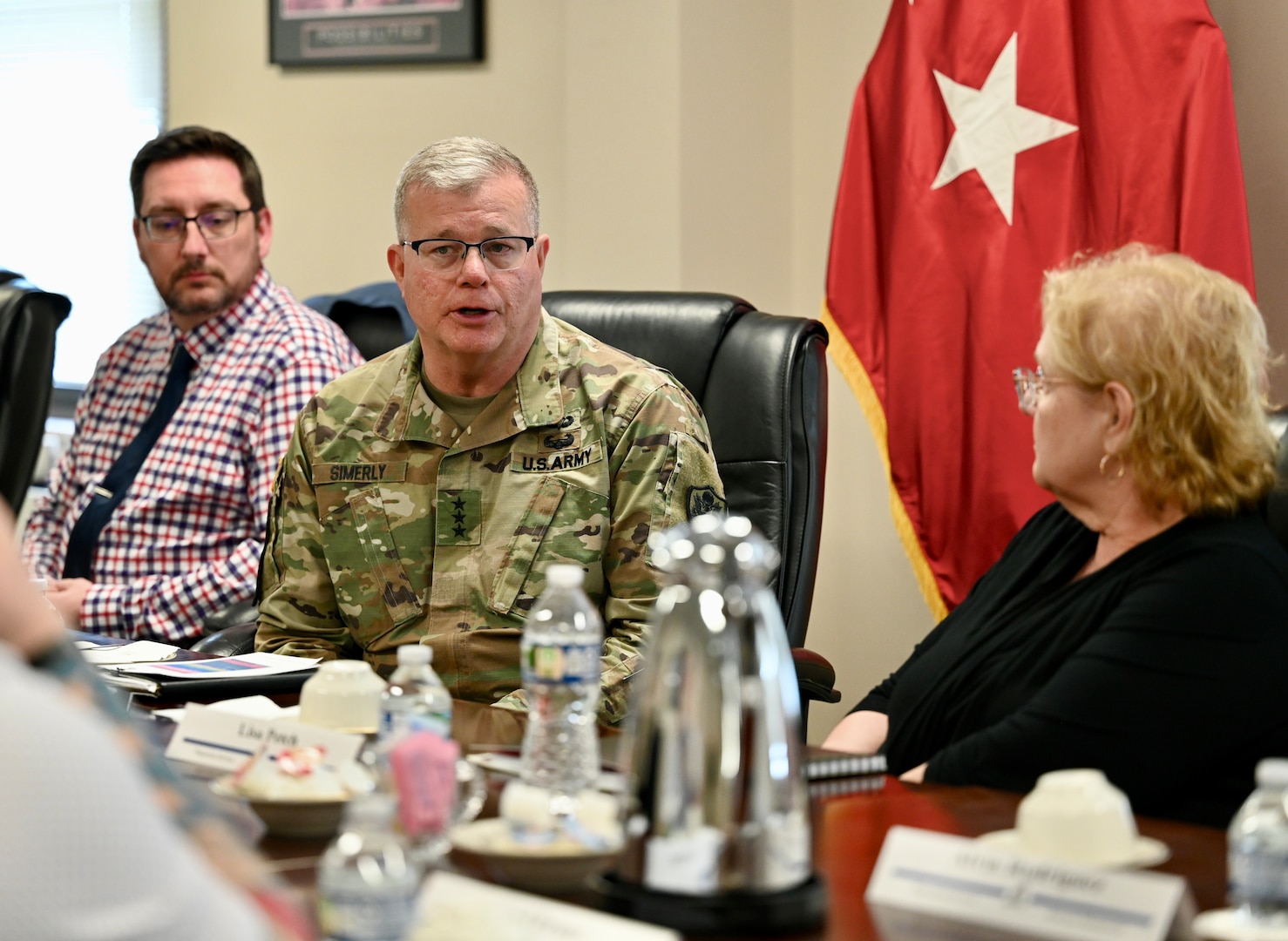 Defense Logistics Agency Director Lt. Gen. Mark Simerly, center, speaks to DLA Disposition Services staff during a recent visit to the Hart-Dole-Inouye Federal Center on April 2.